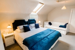 John McDouall Stuart View - Bedroom with bed set as a double and extra single bed in the room
